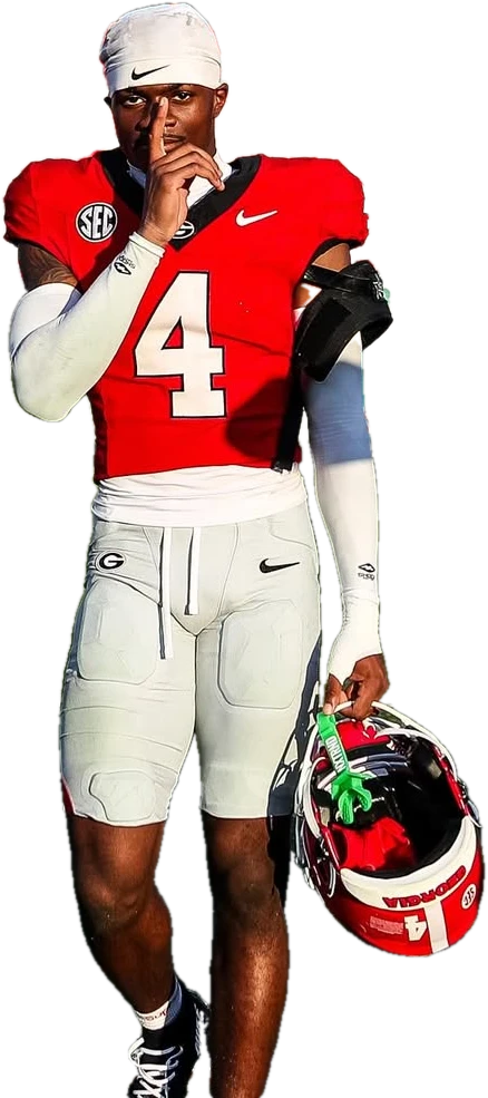 KJ Bolden with a finger to his lips, helmet in hand
